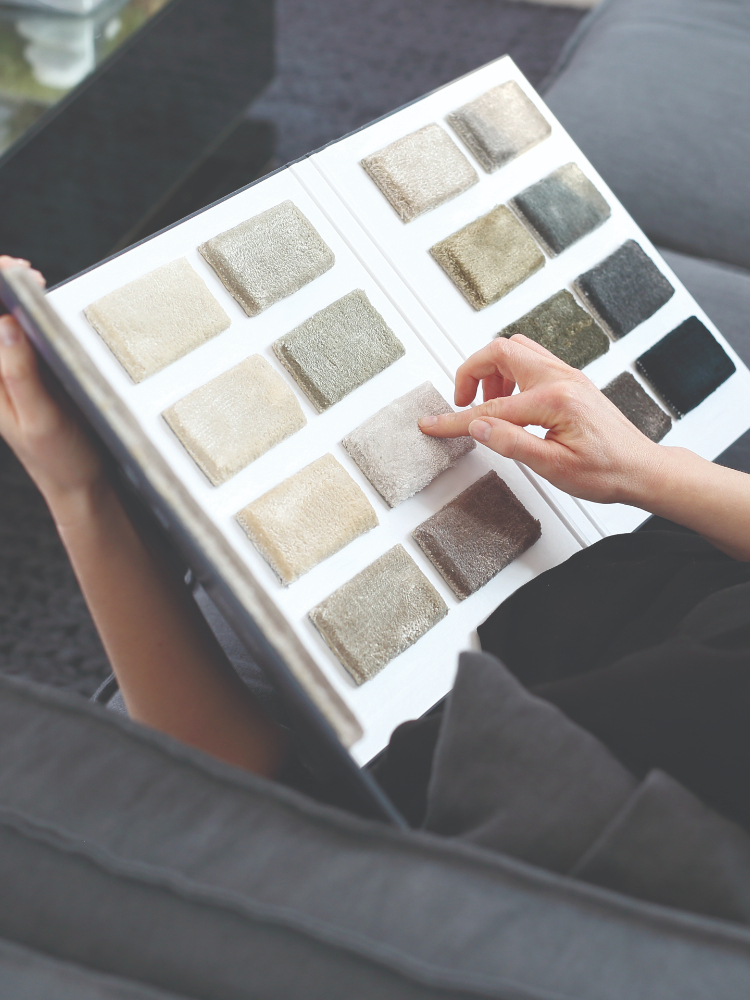 customer looking at carpet flooring samples